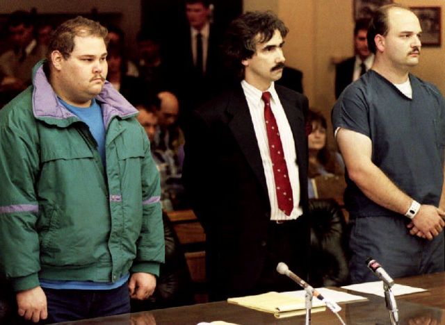 PORTLAND, : Shawn Eric Eckardt (L), bodyguard of figure skater Tonya Harding, and fellow defendent Derrick Smith (R) are joined by Smith's attorney Robert Goffredi 14 January 1994 as they face Judge Donald Londer during their arraignment on charges of conspiracy to commit assault in the attack on skater Nancy Kerrigan. The two men were charged for the 06 January 1994 attack on Kerrigan. (Photo credit should read CHRIS WILKINS/AFP/Getty Images)