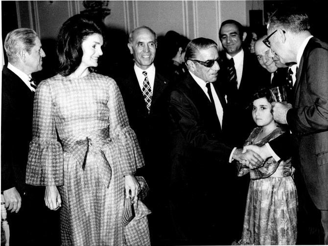 Jacqueline Kennedy Onassis, left, and Aristotle Onassis, wearing dark glasses, appear with host Fallah and his granddaughter in Iran, May 1972. (AP Photo)